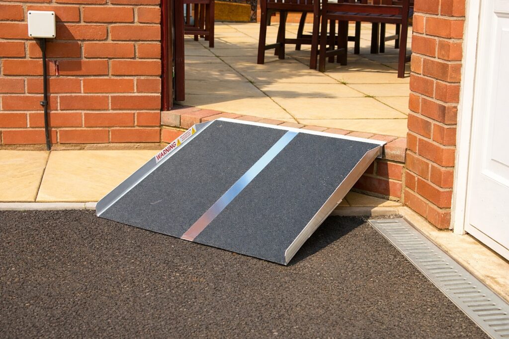 Low-profile threshold access ramp fitted to a home entrance in Warwickshire