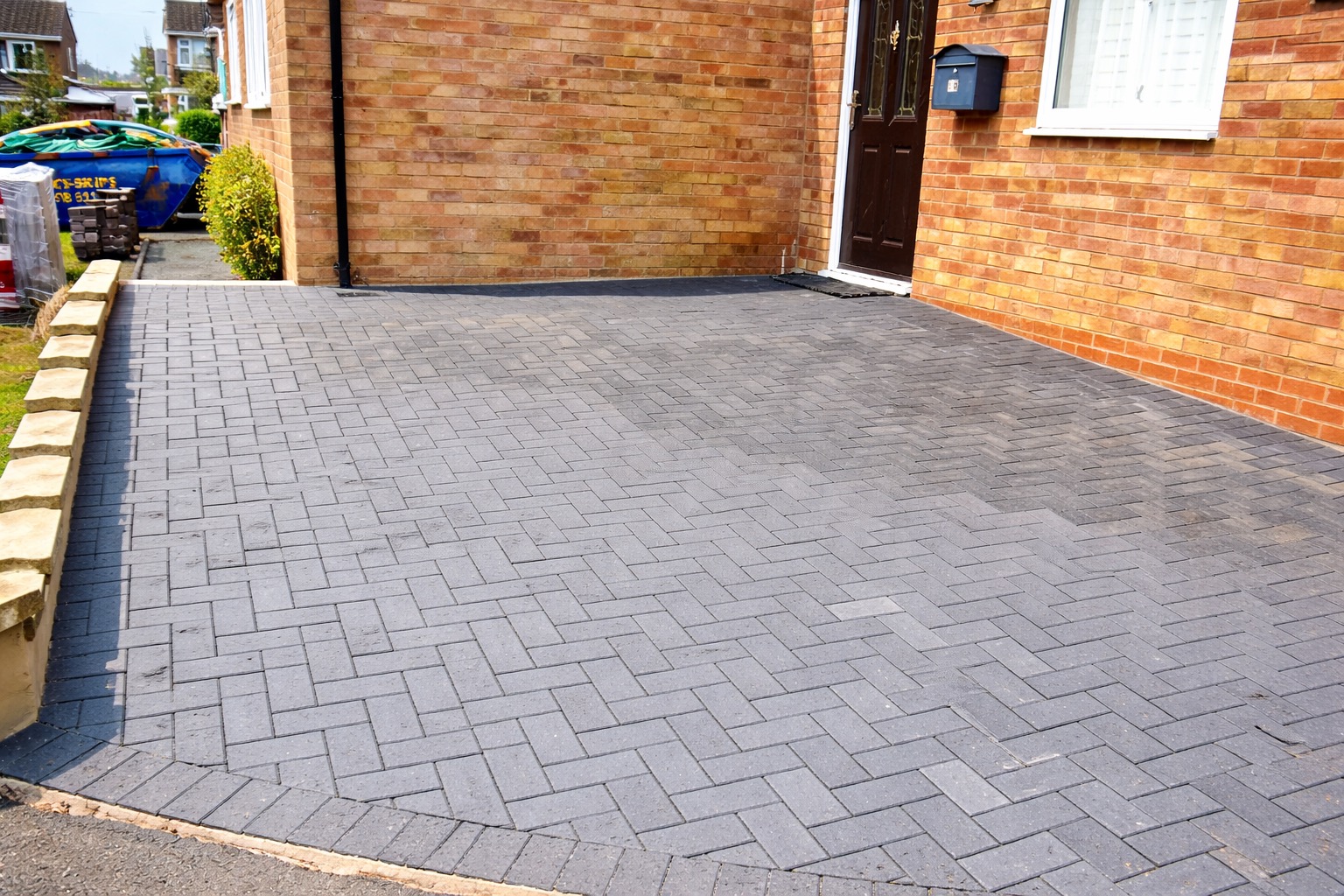 Block paved wheelchair ramped driveway providing level access to a residential entrance in Warwickshire