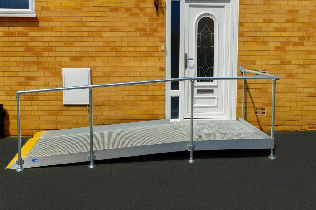 Modular wheelchair access ramp with handrails installed at a residential property in Leamington Spa, Warwickshire.