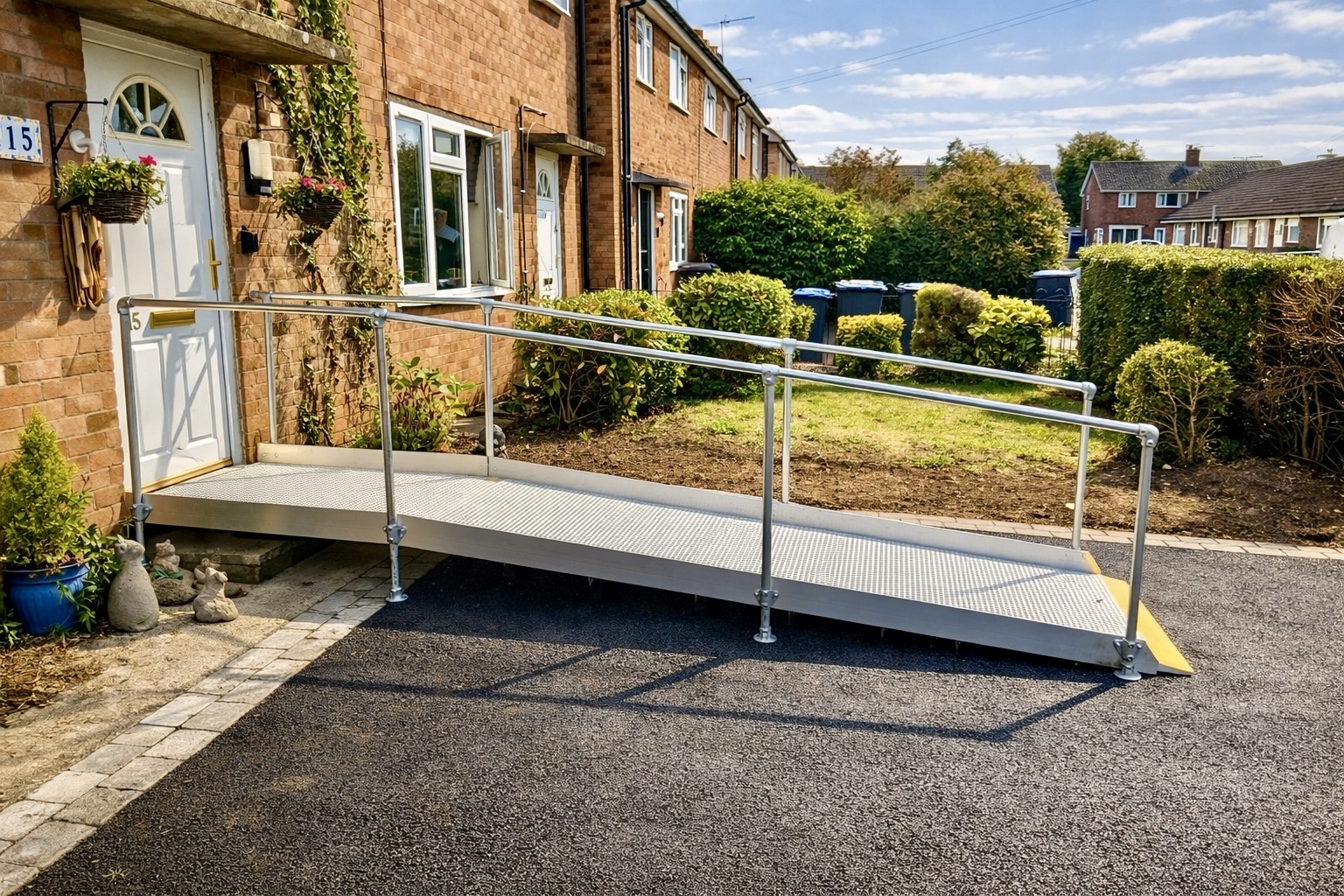 Modular wheelchair access ramp with handrails installed at a residential property in Wellesbourne, Warwickshire.