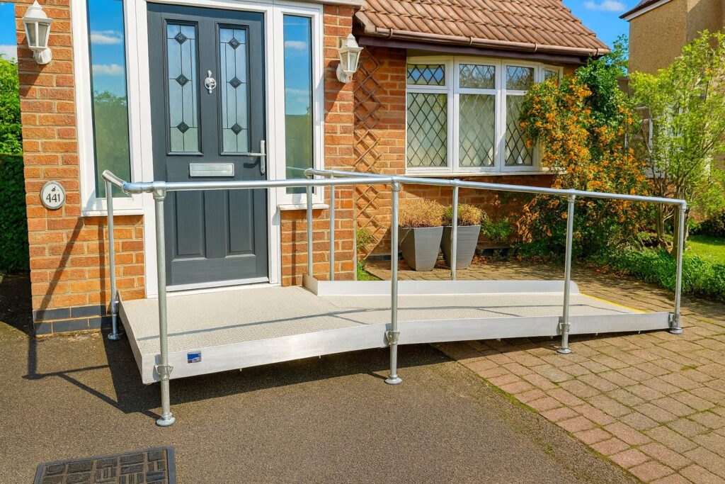 Threshold wheelchair ramp providing step-free access to a residential property in Rugby, Warwickshire.