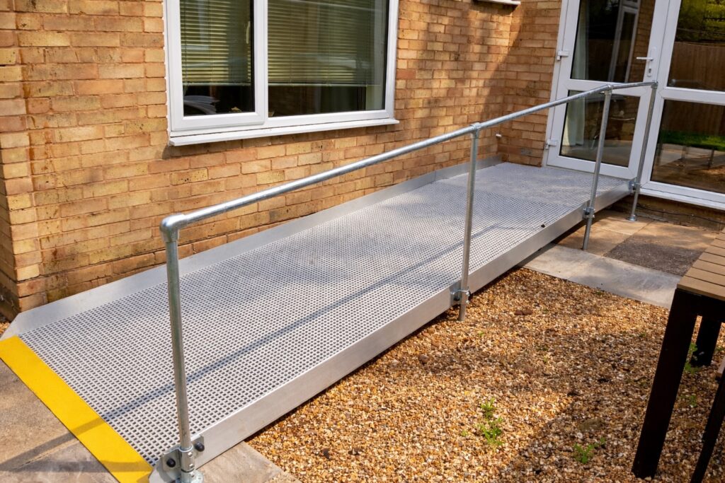 Modular wheelchair access ramp with handrails installed at a residential property in Shipston-on-Stour, Warwickshire.