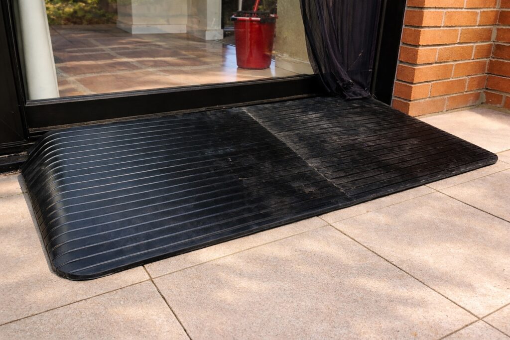 Threshold wheelchair ramp providing step-free access to a patio door at a residential property in Alcester.