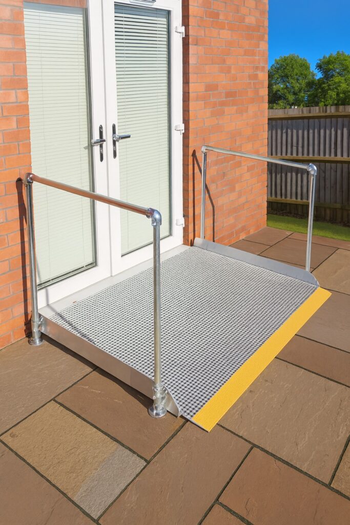 Threshold wheelchair ramp providing step-free access to the back garden at a residential property in Nuneaton, Warwickshire.