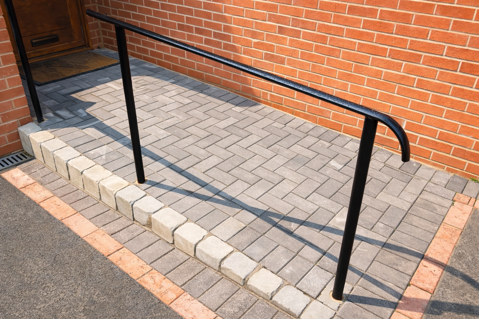 Bespoke handrails to a wheelchair ramp at a private home in Hockley Heath, Warwickshire.